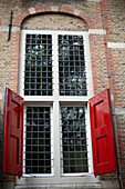 Gouda, The Netherlands, Old library, Historic windows, Red shutters