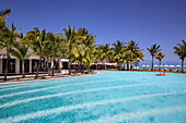 Swimming pool and coconut palm trees at Dinarobin Beachcomber Golf Resort & Spa (Beachcomber Resorts), Le Morne, Rivière Noire, Mauritius, Indian Ocean