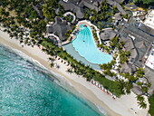 Aerial of beach and swimming pool at Dinarobin Beachcomber Golf Resort & Spa (Beachcomber Resorts) with Le Morne mountain behind, Le Morne, Rivière Noire, Mauritius, Indian Ocean