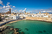  Old town of Monopoli with the cathedral, city walls and the beach Cala Porta Vecchia seen from above, Apulia, Italy, Europe 