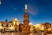  The square Piazza Salandra with the column Guglia dell&#39;Immacolata and the church Chiesa di San Trifone at dusk, Nardo, Apulia, Italy, Europe 