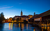 Old Town and the Historical Covered Wood Bridge Holzbrücke over River Aare in Blue Hour in Olten, canton Solothurn, Switzerland.