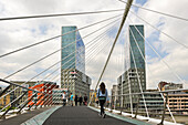 the Zubizuri, tied arch footbridge across the Nervion River, designed by architect Santiago Calatrava, with, in the background, the Isozaki Atea twin towers designed by Japanese architect Arata Isozaki, Bilbao, province of Biscay, Basque Country, Spain,Europe