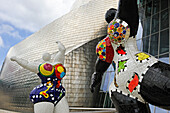 temporary exhibition of "Nanas" by the French artist Niki de Saint Phalle (1930-2002) at the Guggenheim Museum designed by architect Frank Gehry, Bilbao, province of Biscay, Basque Country, Spain,Europe