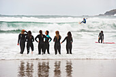 surf class on Zurriola beach, district of Gros, San Sebastian, Bay of Biscay, province of Gipuzkoa, Basque Country, Spain,Europe