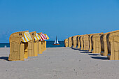  Beach baskets, sailing boat, Travemuende, Hanseatic City of Luebeck, Schleswig-Holstein, Germany 