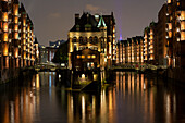  View of the moated castle in the evening, Speicherstadt, Hanseatic City of Hamburg, Germany 