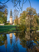  The tower of the city palace is reflected in the Ilm, Weimar, Thuringia, Central Germany, East Germany, Germany, Europe 