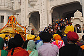 People carrying palanquin, golden temple, amritsar, punjab, india, asia