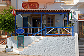 Exterior view of a small Greek cafe. Elounda village, Crete, Greece.