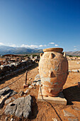 Giant pythos (storage jar) at the ruins of ancient Minoan Palace of Malia. Crete, Greece.