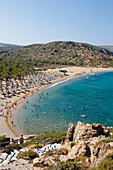 People bathe in the sea at Vai Palm Beach. Crete, Greece.