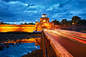 Moat and wall of The Citadel (Imperial City) illuminated at dusk. Hue, Vietnam.