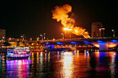 Dragon head on the Dragon Bridge (Cau Rong) breathes fire at night. Da Nang city, Vietnam.