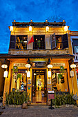 An old house in Hoi An Ancient Town illuminated at dusk.  Hoi An, Quang Nam Province, Vietnam.