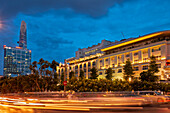 Traffic light trails in Nguyen Hue street at dusk. District 1, Ho Chi Minh City, Vietnam.