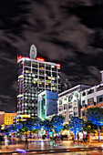 Buildings on Nguyen Hue Street illuminated at night. District 1, Ho Chi Minh City, Vietnam.