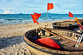 Traditional Vietnamese coracles on Cua Dai Beach. Hoi An, Quang Nam Province, Vietnam.