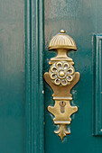  Bronze handle on old front door 