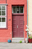  Red front door on red facade 