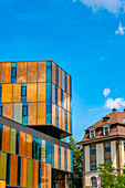 Beautiful Modern Building and an Old House with Window in a Sunny Summer Day in City of  Fribourg, Canton Fribourg, Switzerland.