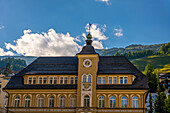 Beautiful Town Hall and Mountain with Blue Sky in a Sunny Summer Day in St Moritz, Grisons, Switzerland.