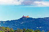  View of Palácio Nacional da Pena, taken at Azenhas do Mar is a coastal town in the municipality of Sintra, Portugal. It is part of the civil parish of Colares.  