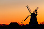  Windmill Oldsum at sunset, Foehr Island, North Frisia, Schleswig-Holstein, Germany 