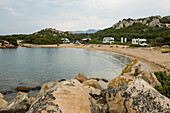  Lonely beach with granite rocks and campers, wild parking spot, sunrise, Spiaggia Poltu Manzu, Capo Ceraso, near Olbia, Sardinia, Italy 