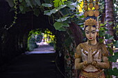  Close-up of praying hands on a golden figure in a handicraft factory on &quot;Silk Island&quot;, Kaoh Oknha Tei, Khsach Kandal District, Kandal, Cambodia, Asia 