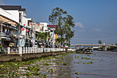  City and river bank on a tributary of the Mekong, Sa Dec, Dong Thap, Vietnam, Asia 