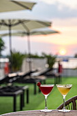  Colorful cocktails on the sun deck of the river cruise ship RV Mekong Discovery (Thurgau Travel) at sunset, near Ho Chi Minh City, Vietnam, Asia 