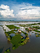  Aerial view of river cruise ship RV Mekong Discovery (Thurgau Travel) on Tonle Sap River with houses on stilts in flood plains, Phsar Chhnang, Kampong Chhnang, Kampong Chhnang, Cambodia, Asia 