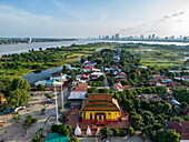  Aerial view of Kaoh Oknha Tei Temple on Silk Island with Mekong River and Phnom Penh skyline in the distance, Kaoh Oknha Tei, Khsach Kandal District, Kandal, Cambodia, Asia 