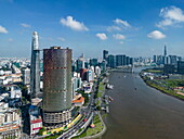  Aerial view of a high-rise building under construction (standing as a ruin since 2013) with the Bitexco Financial Tower (left), the Saigon River and the Landmark 81 Tower in the distance, Quan 4, Ho Chi Minh City, Vietnam, Asia 