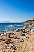 People sunbathe on the Ladies Beach in Kusadasi, Aydin Province, Turkey.