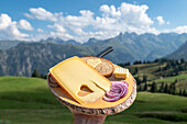  Snack plate in the Allgäu Alps, Fellhorn, stop off, snack, mountain cheese, inn, mountain landscape, Alps, Upper Allgäu, Bavaria, Germany\n 