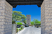  View through the entrance gate to the camp, Okaukuejo, Etosha National Park, Namibia, Africa 