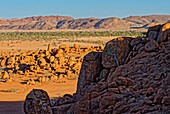  View over the rocks and the barren landscape in the evening light, Twyfelfontein, Kunene, Damaraland, Namibia, Africa 