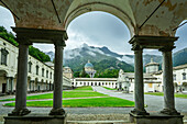  Arcades in the courtyard of the pilgrimage church of Oropa with view of the new and old basilica, UNESCO World Heritage Site Sacri Monti, Biella, Alpi Biellesi, Valais Alps, Piedmont, Italy 