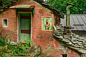  Image of the Black Madonna of Oropa on an old alpine building, GTA, Grande Traversée des Alpes, Biella, Alpi Biellesi, Valais Alps, Piedmont, Italy 