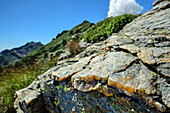  Rock with quartz and Alpi Biellesi out of focus in the background, GTA, Grande Traversée des Alpes, Biella, Alpi Biellesi, Valais Alps, Piedmont, Italy 