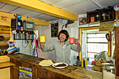  Landlady of the Rifugio Rosazza hut serves two cups of coffee, Rifugio Rosazza, GTA, Grande Traversée des Alpes, Biella, Alpi Biellesi, Valais Alps, Piedmont, Italy 