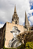 Mural with the effigy of Jean Moulin (1899-1943), hero of the French Resistance during the Second World War, who was prefect of Eure-et-Loir in Chartres, In the background the towers of the cathedrale, City of Chartres, Eure-et-Loir department, Centre-Val-de-Loire region, France, Europe