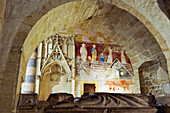 Recumbent effigy of Bishop Henri de Severy with in background mural painting from early 15th century on the north wall of the Choir,Church of Romainmotier Priory,Canton of Vaud,Switzerland,Europe