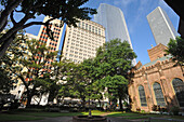 Christ Church Cathedral's garden with Magnolia Hotel in the background, downtown Houston, Texas, United States of America, North America