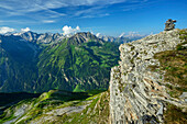  Stone man on the summit of the Brandenberger Kolm, Zillertal Alps with Ahornspitze in the background, Brandenberger Kolm, Zillertal Alps, Tyrol, Austria 