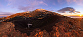  View of the summit crater and secondary craters of Mount Etna at blue hour and sunrise, UNESCO World Heritage Volcano, stratovolcano, Mount Etna, Italy, Sicily, panorama\n 