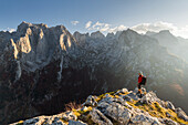  a hiker looks into the Karanfili mountains, Prokletije massif, Gusinje, Montenegro 