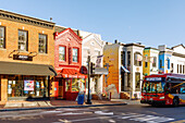  Colorful houses and bus on Wisconsin Street in the Georgetown neighborhood of Washington DC, District of Columbia, USA 